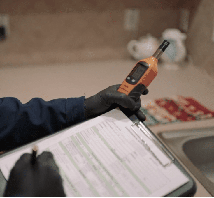 Mold Testing Houston worker performing a humidity check