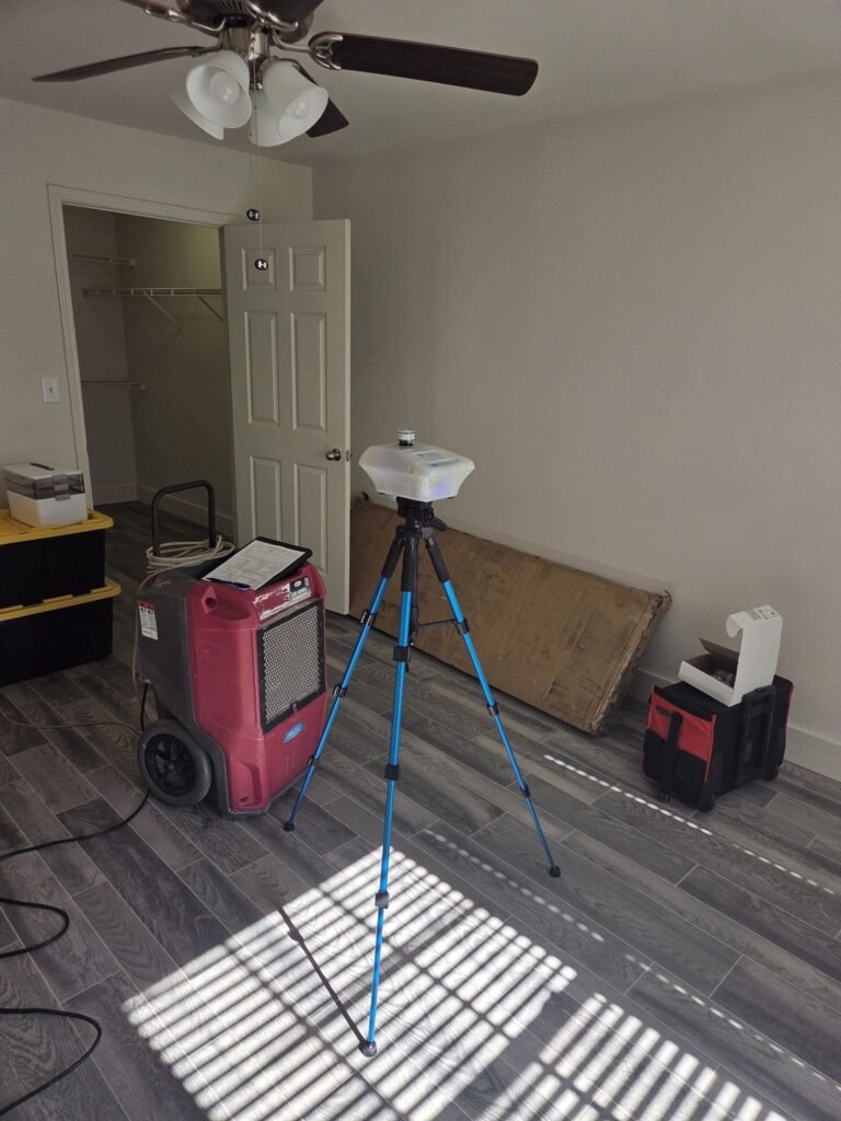 Air sampling in progress in an apartment following water damage
