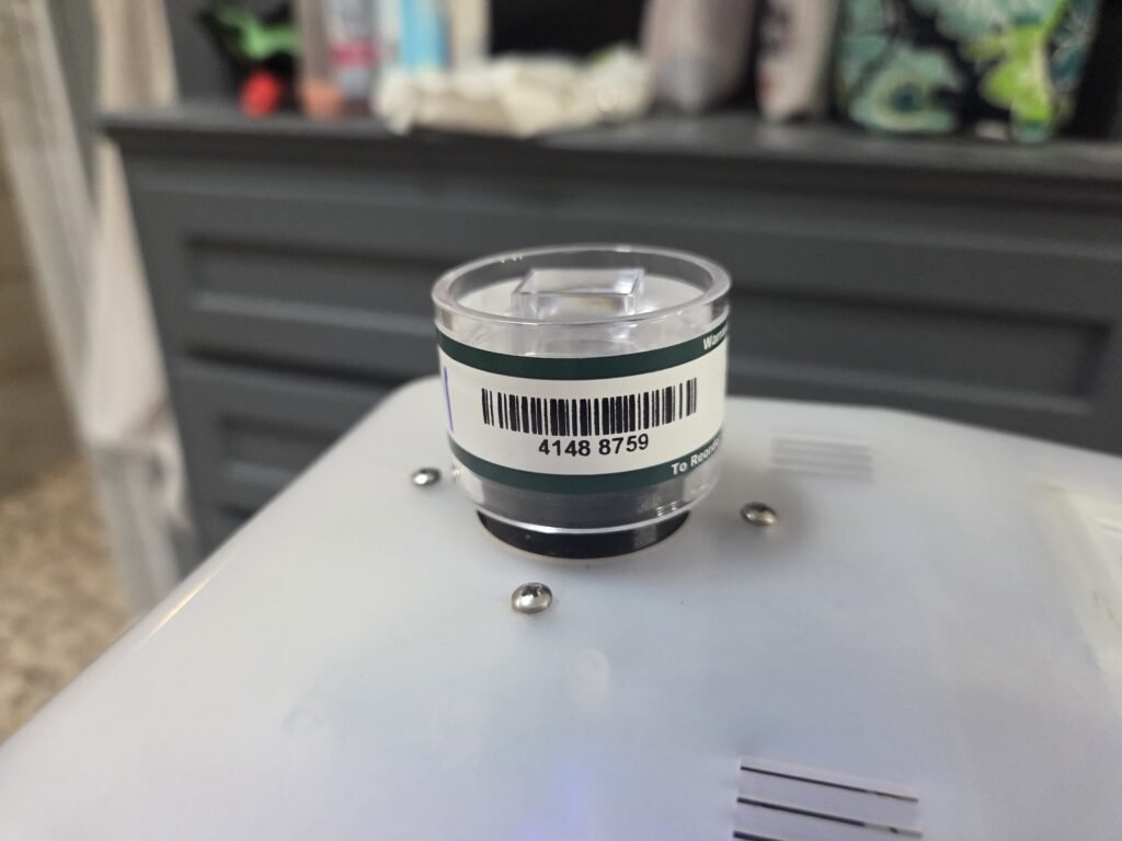 Spore trap cassette collecting an air sample during a Willowbend mold inspection