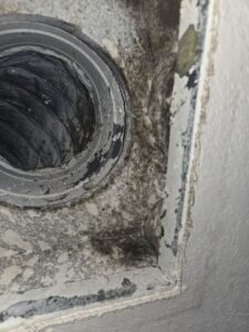 Mold growth around a ceiling HVAC supply boot found during a mold inspection in a Pearland, TX home