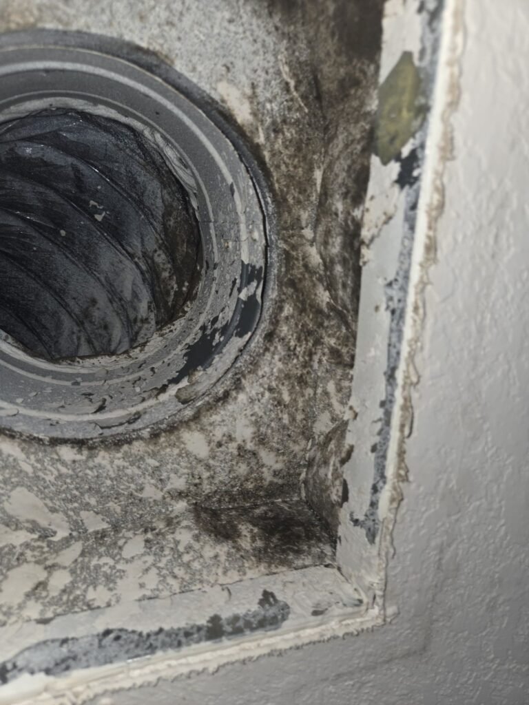 Mold growth around a ceiling HVAC supply boot found during a mold inspection in a Pearland, TX home