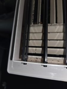 Dark spotting on an HVAC supply register in a Pearland, TX home